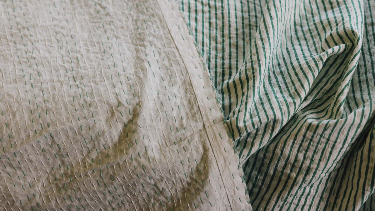 close up of reversible kantha bedspread.