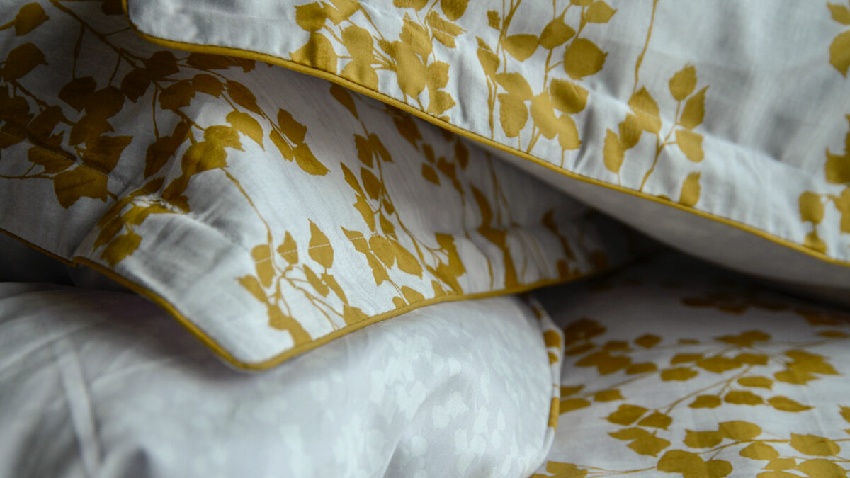 reversible leaf print duvet cover set in mustard yellow and white a close up view