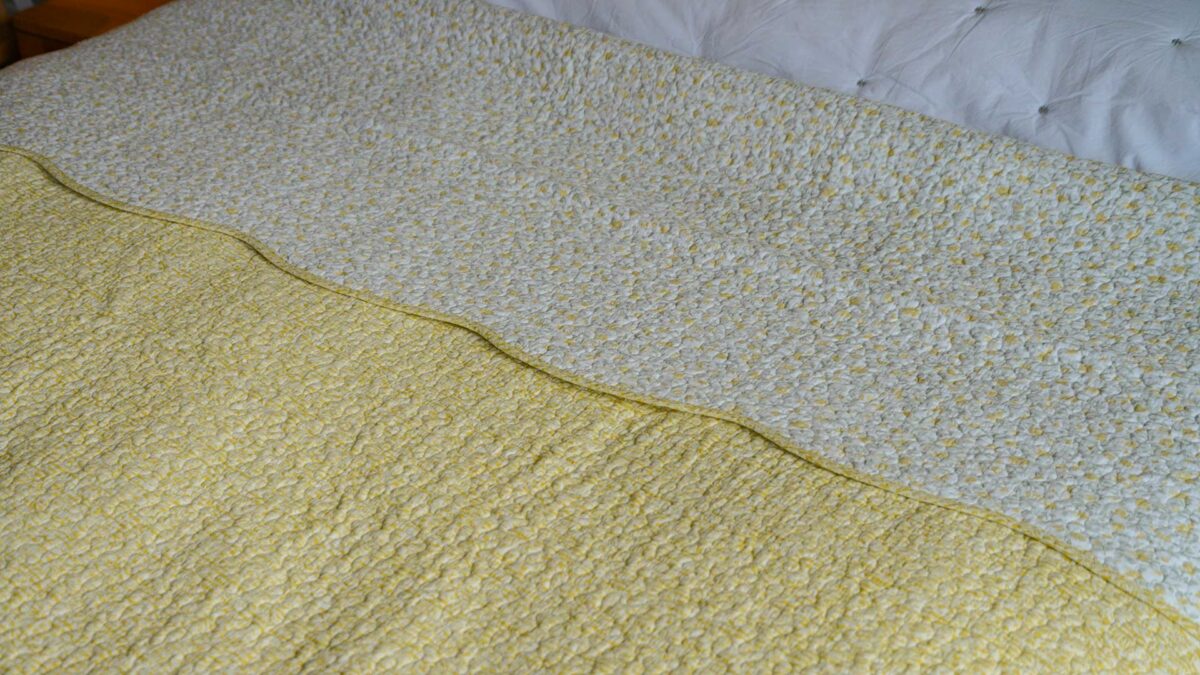 reversible bedspread in yellow ivory and grey