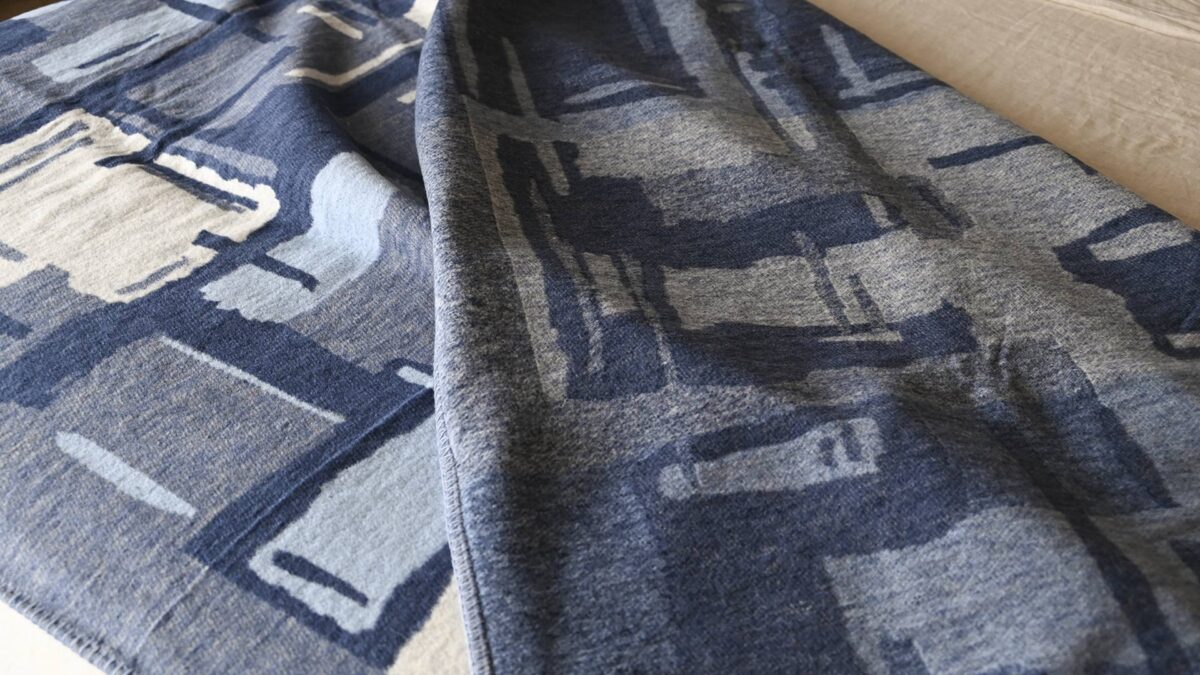 close up of a blue abstract pattern throw.