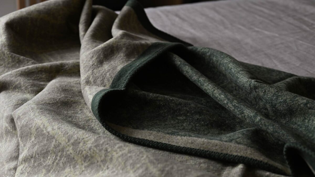 sage and fir green throw with crosshatch pattern.