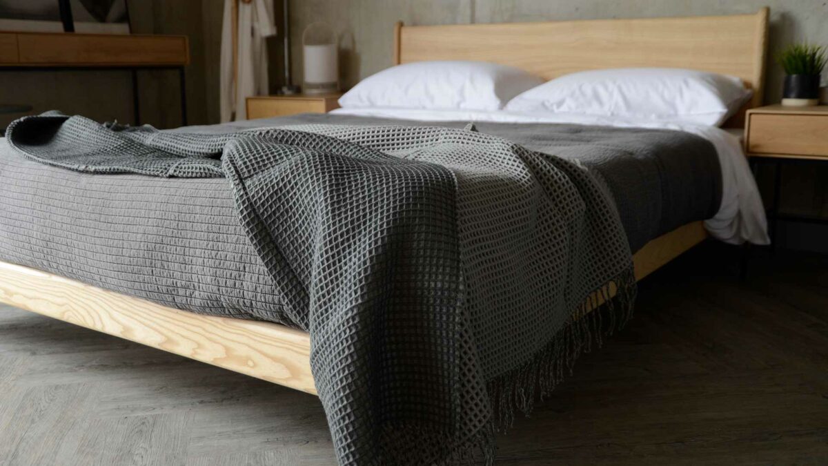 cosy waffle knit reversible throw in light and dark grey