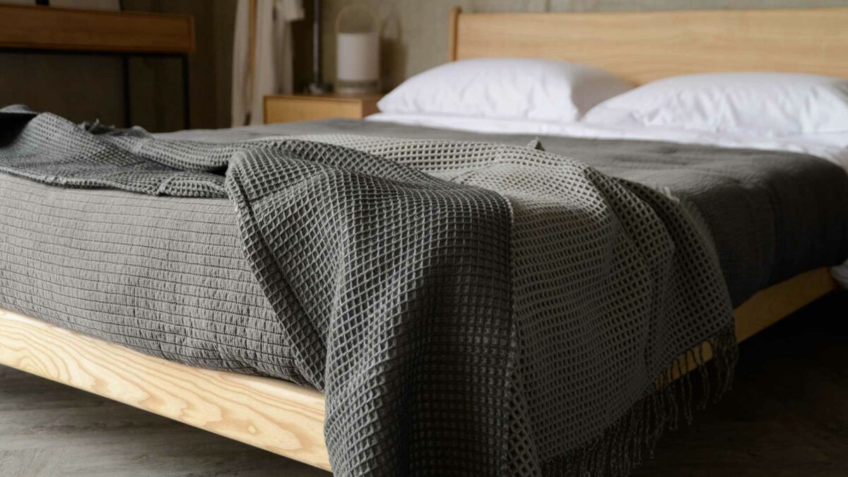 reversible grey knitted waffle-effect blanket