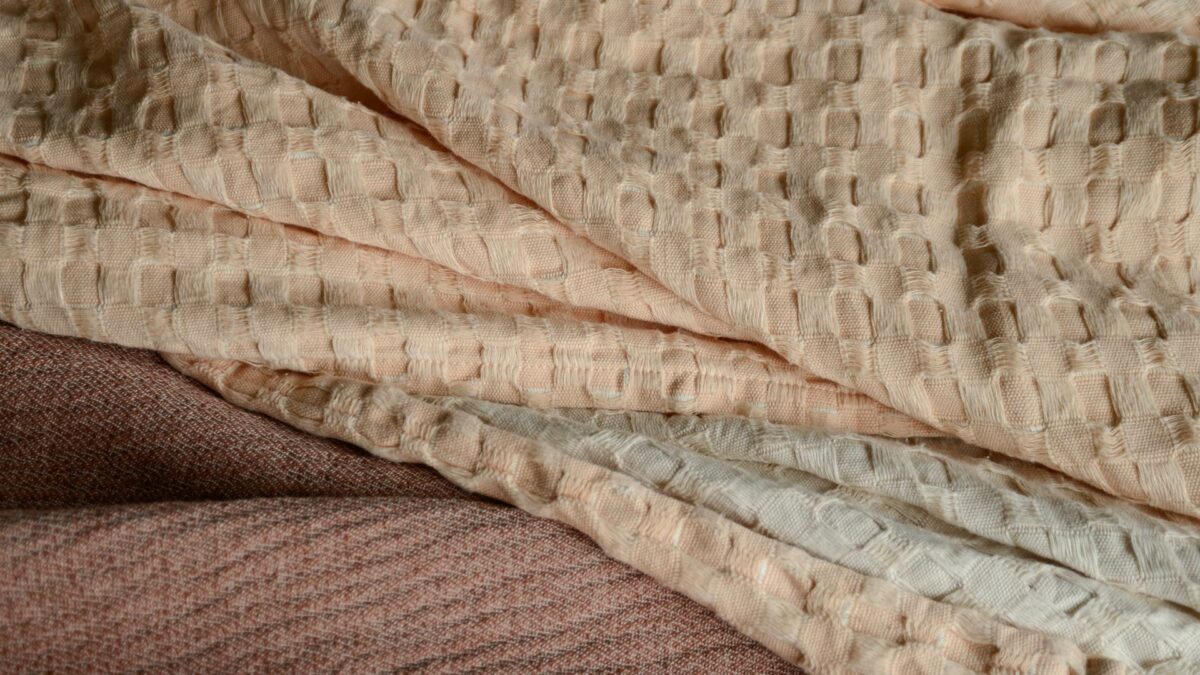 reversible waffle throw in peach and ivory