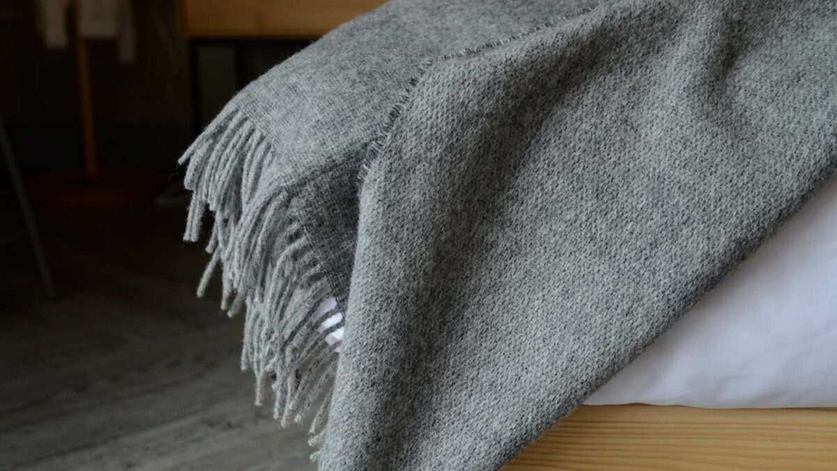 reversible wool throw in grey