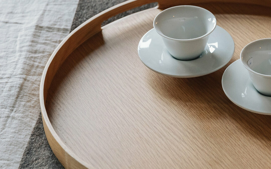 round oak tray with white cups portrait