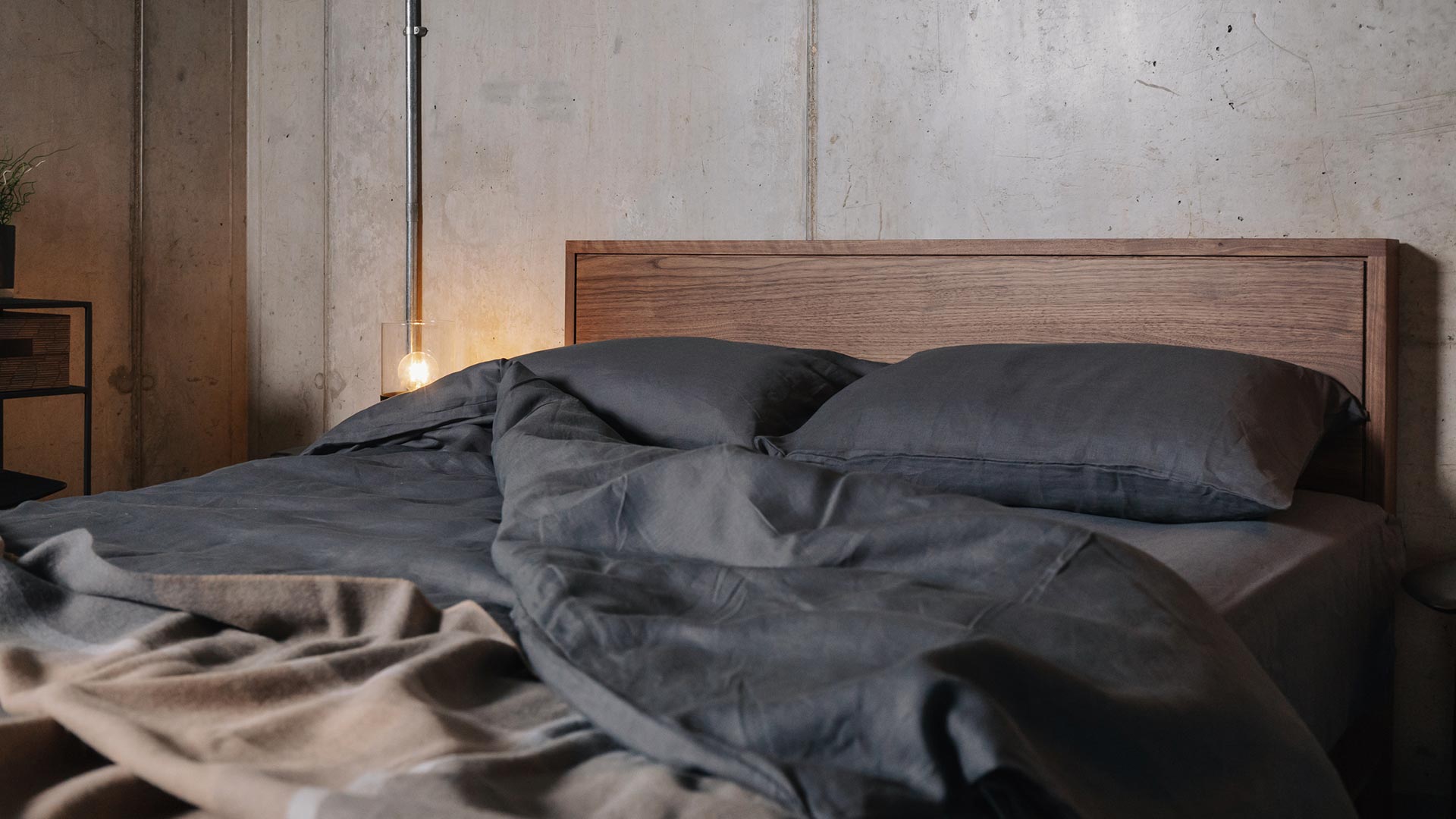 dark grey linen bedding on a kingsize walnut Leith bed for a Nordic look