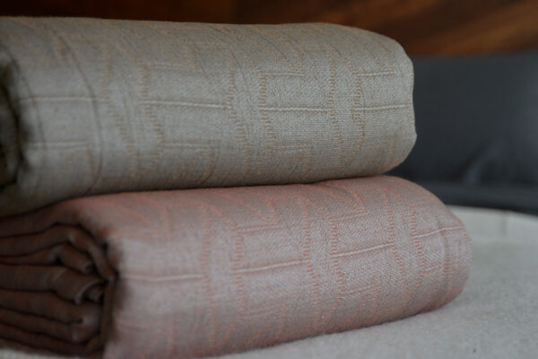 textured pattern lightweight cotton rich bedspreads in a rust red or mushroom colour