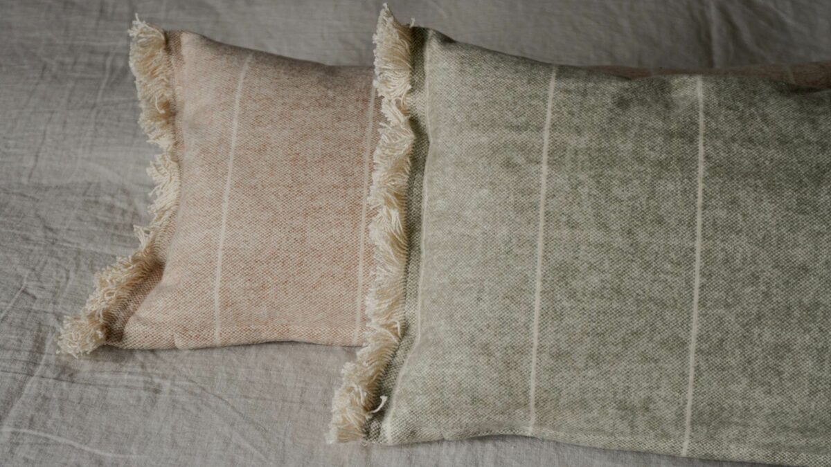 soft touch striped rectangular cushions in a choice of sage green or terracotta and cream