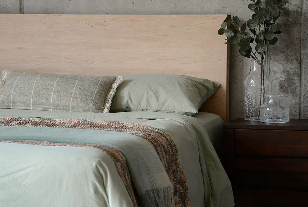 sage cotton bedding with maple bamford bed portrait