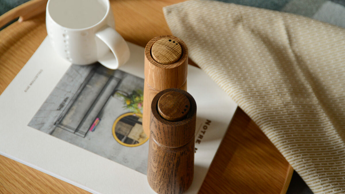 wooden salt and pepper mill from above on tray