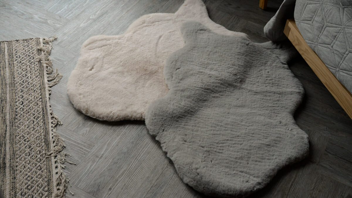 sand and grey small fur rugs