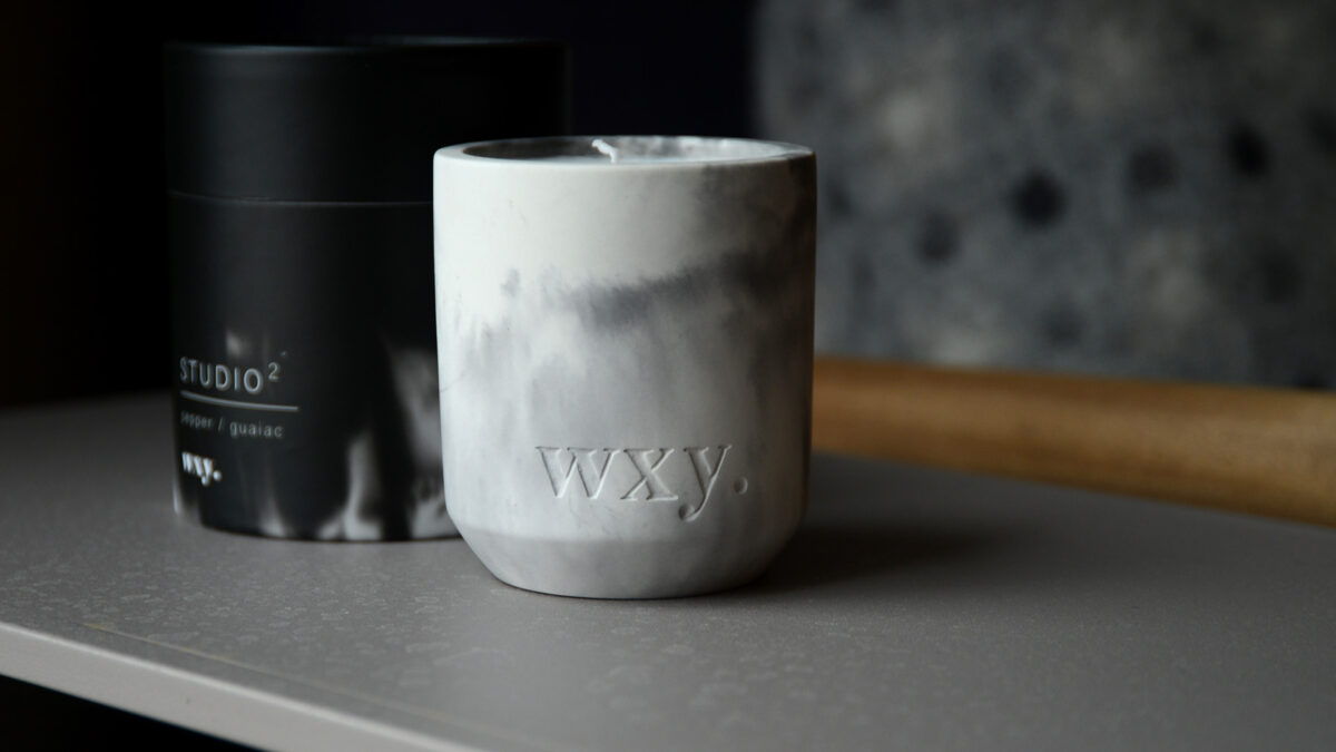 Scented candle in marbled look concrete pot with gift box