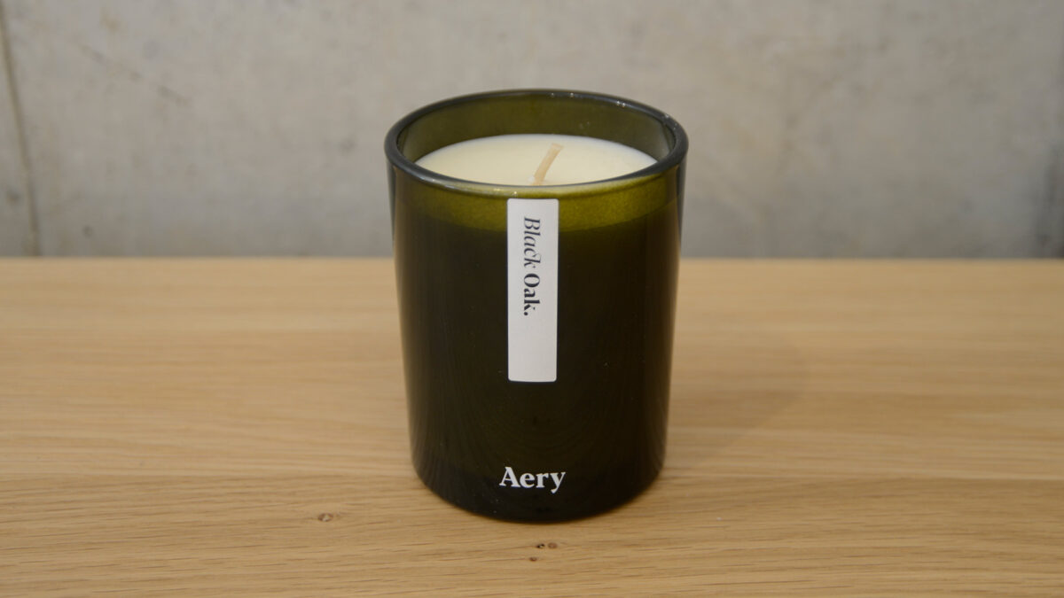 scented candle in green glass jar black oak