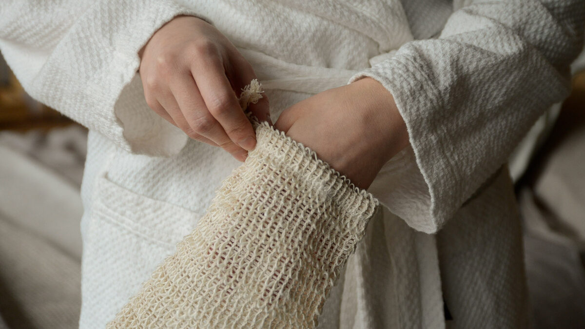 scrub mitt on hand