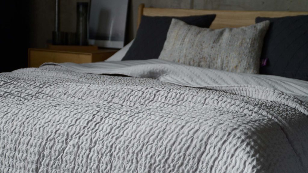 light grey quilt