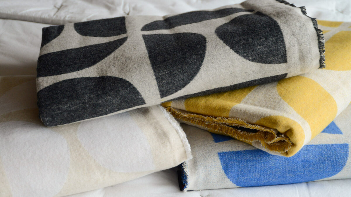 graphic patterned soft cotton throws in a choice of colours