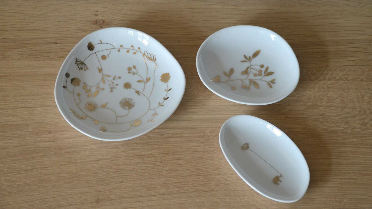 set of gold decorated dishes
