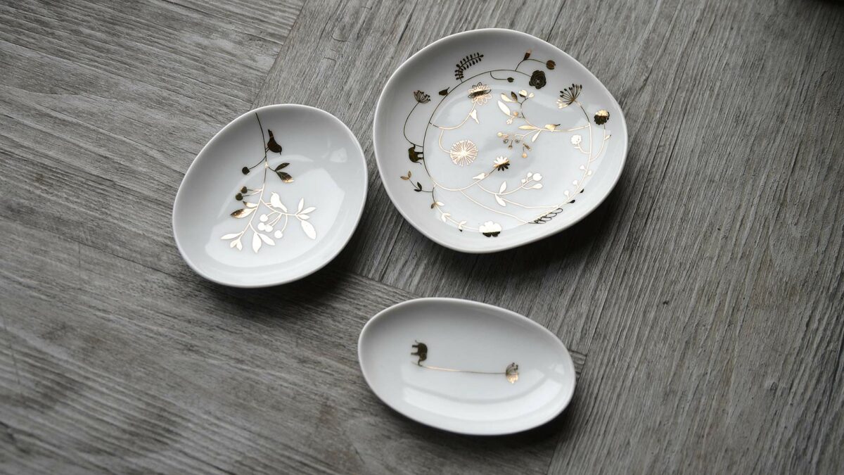 set of small dishes with gold decoration