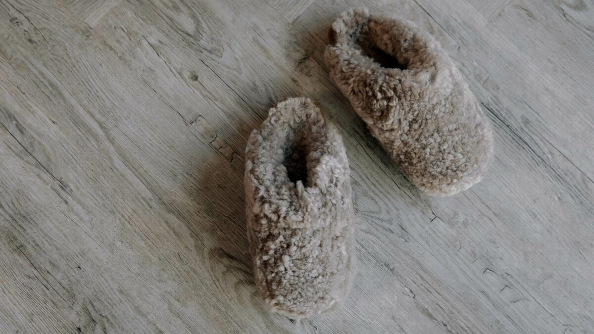 Taupe coloured curly sheepskin slippers in a range of sizes