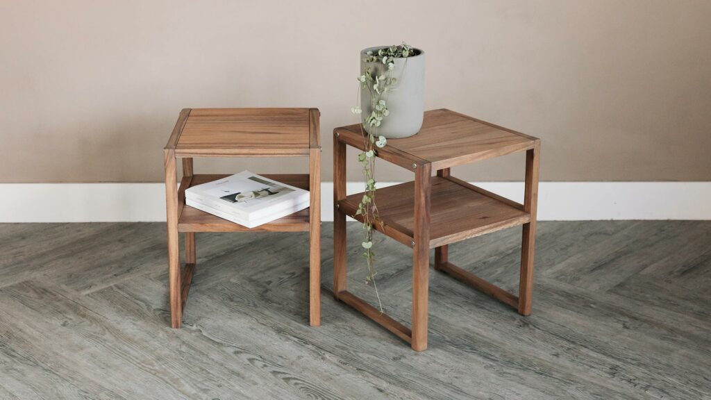 a pair of dark wood bedside tables with shelf