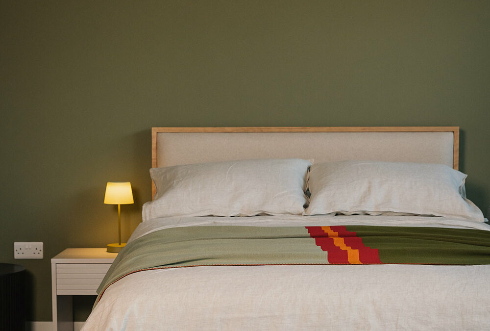 shetland bed with green and red reversible throw portrait