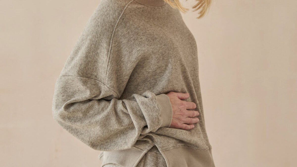 Soft grey sweatshirt with side split.