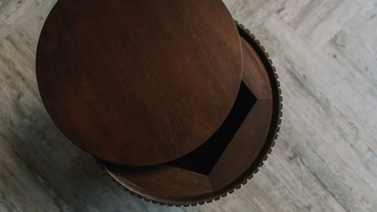 Storage stool or side table in dark mahogany shown with lid open