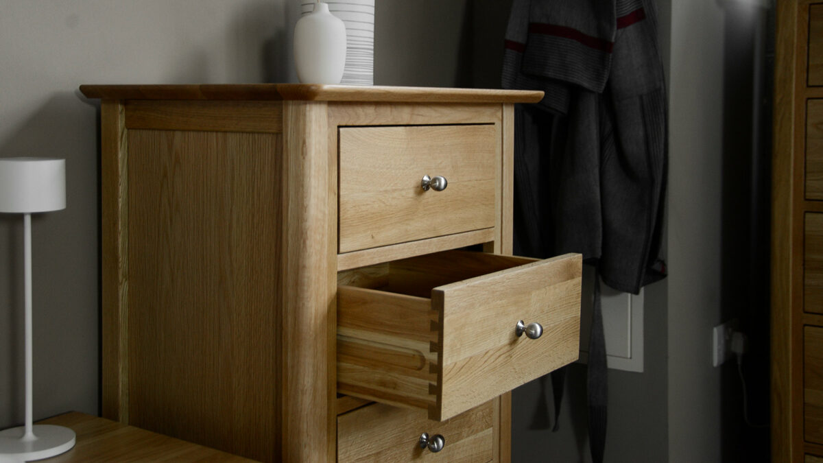 classic oak tallboy chest of drawers shown with drawer open