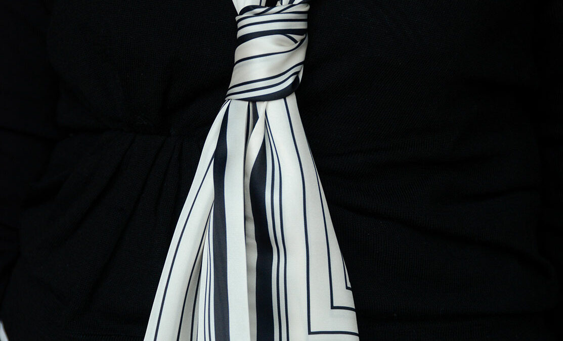 slim silk feel scarf in ivory with black stripes shown knotted