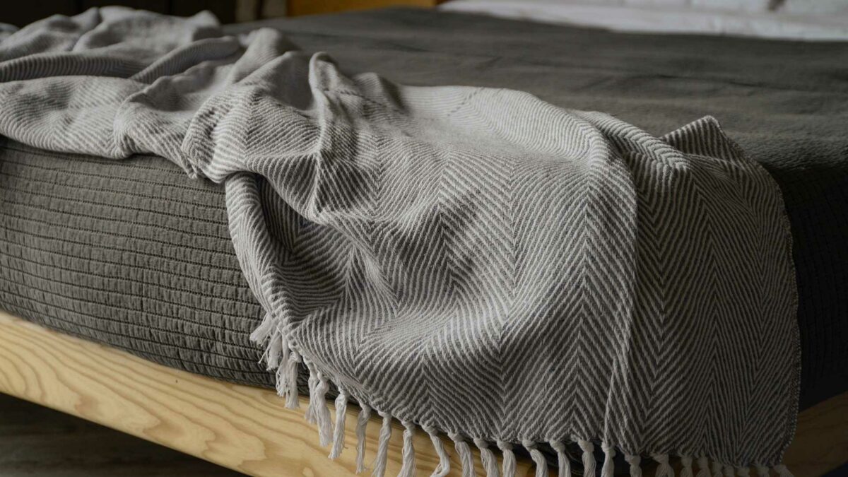 rustic look throw with chevron weave and made with recycled fibres