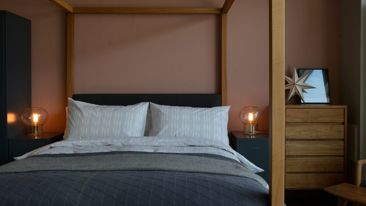 silver grey ikat stripe duvet set on walnut Highland bed