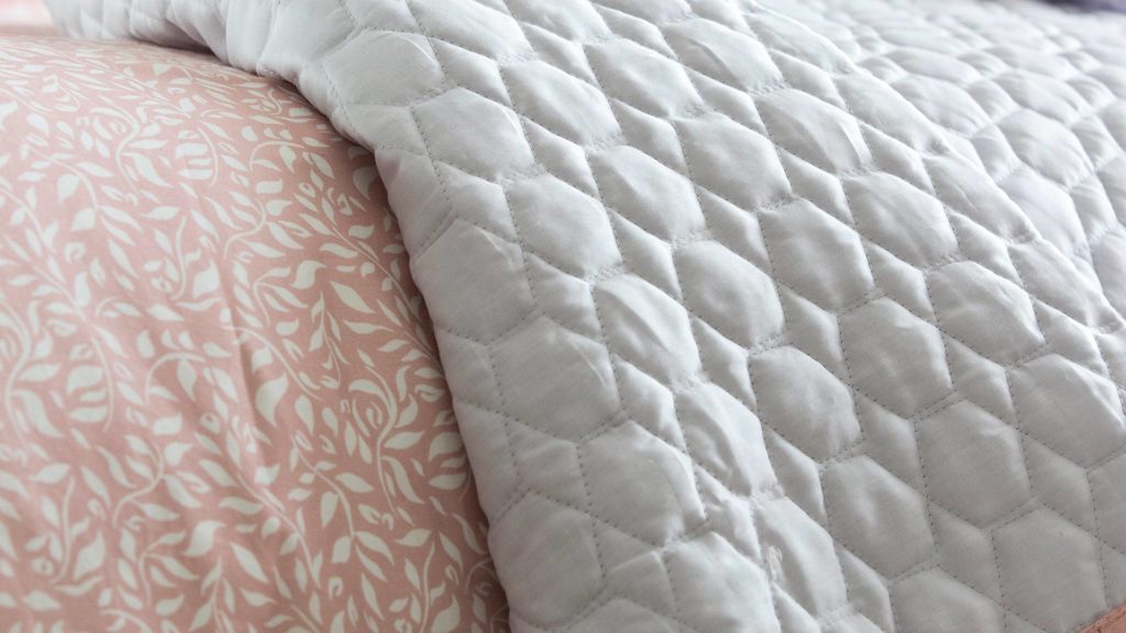 silver grey-quilted-bedspread with pink edge