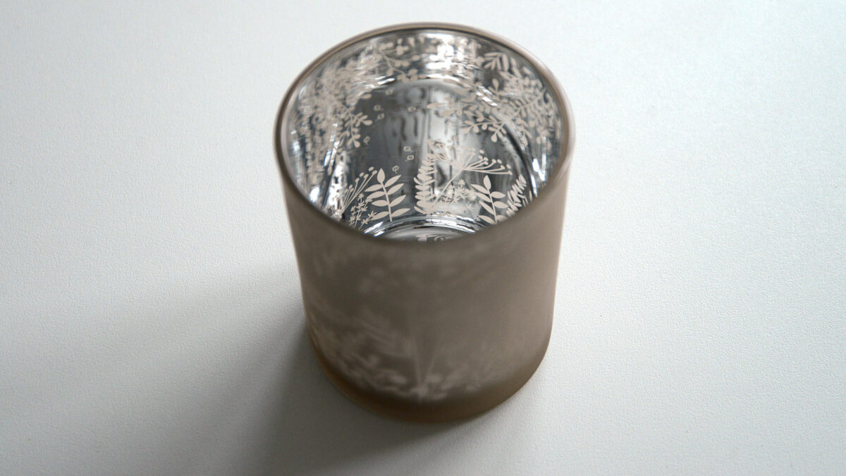 silvered inside of patterned glass candle holder