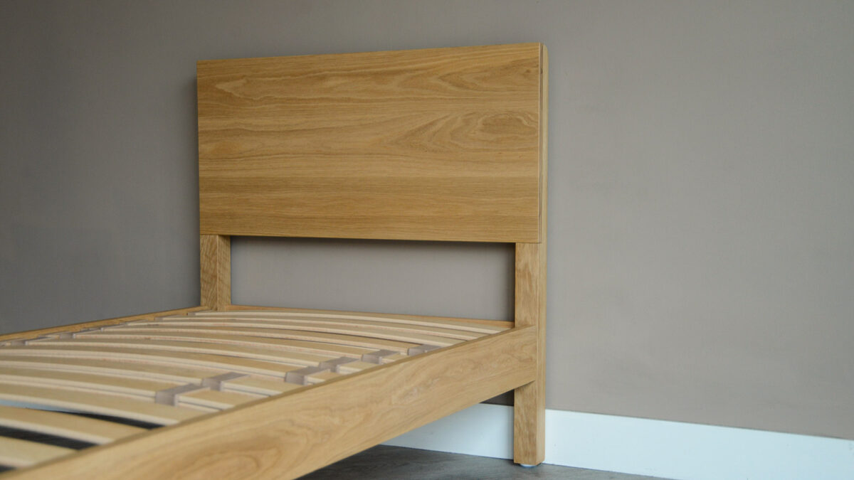 solid oak single bed shown without mattress