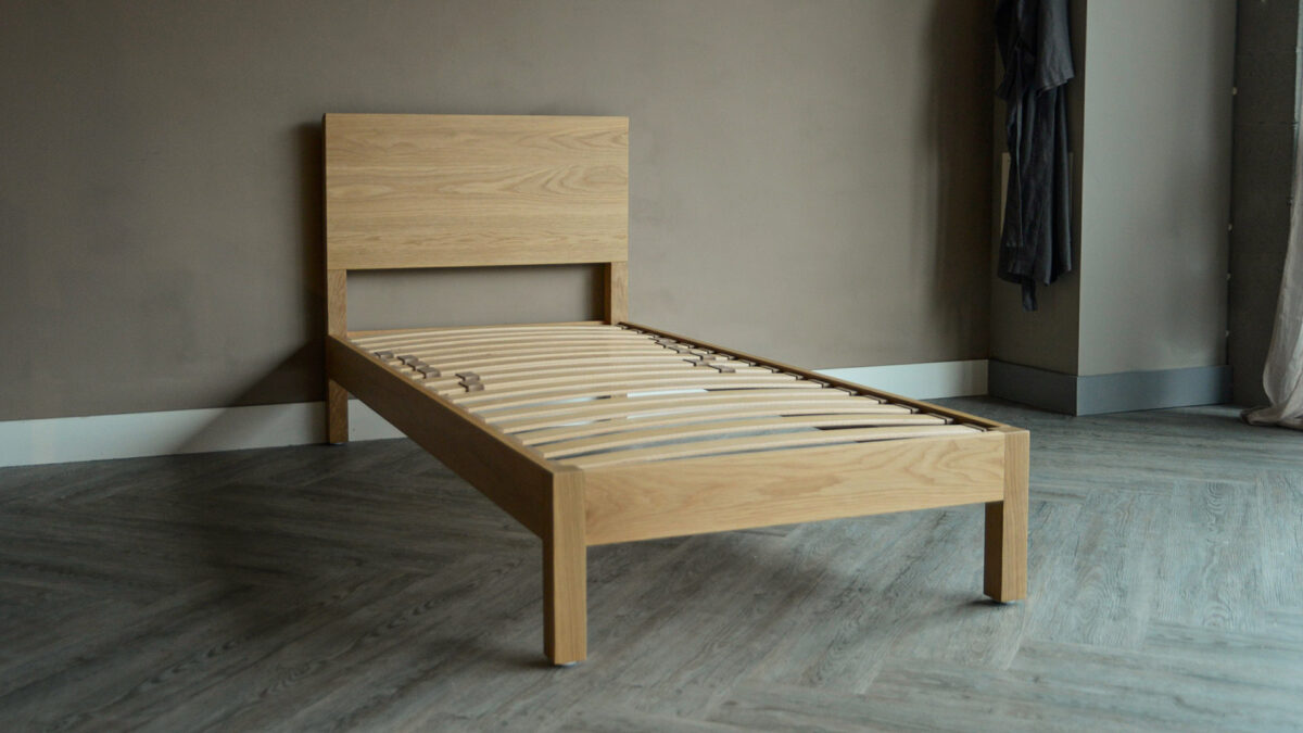 solid oak single bed shown without mattress