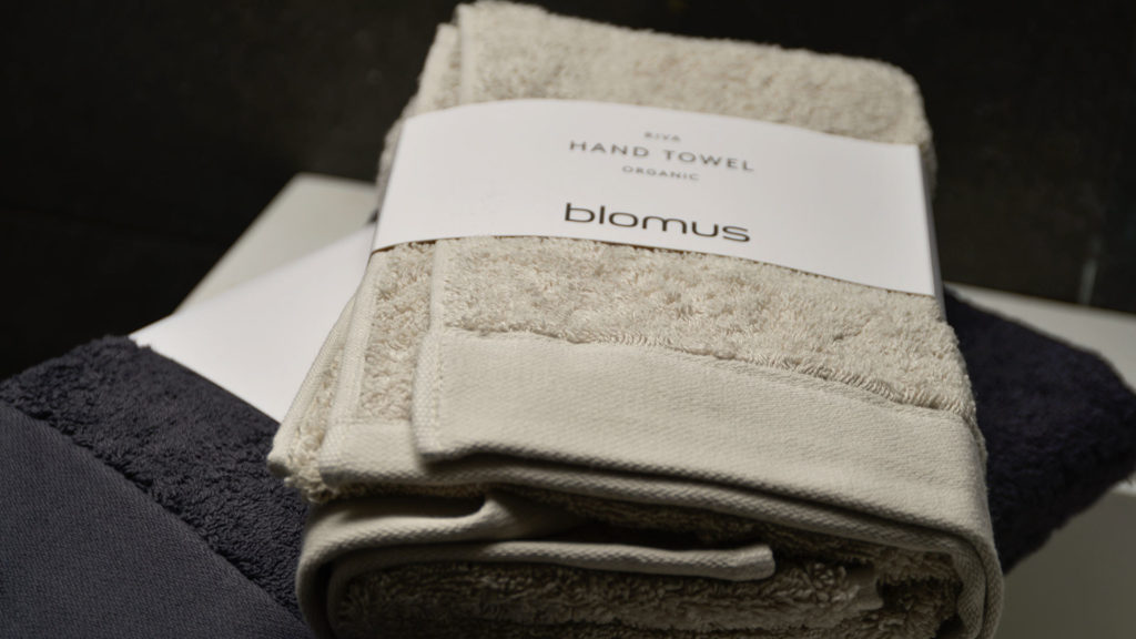 organic cotton bathroom towels in dark grey or pale clay