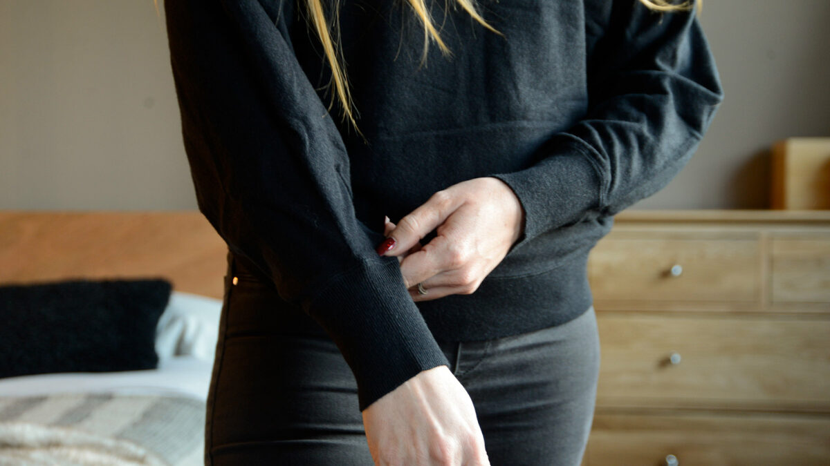black sweatshirt with batwing sleeves a close up of the cuffs