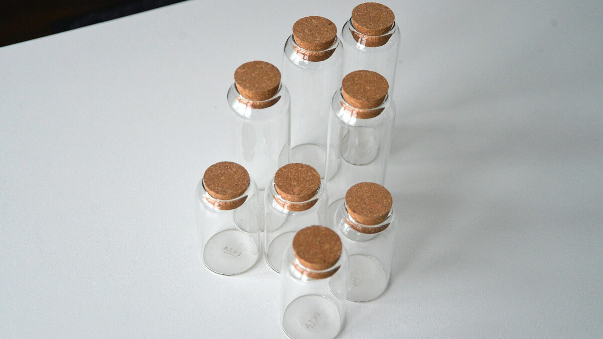 slim glass jars with cork stoppers