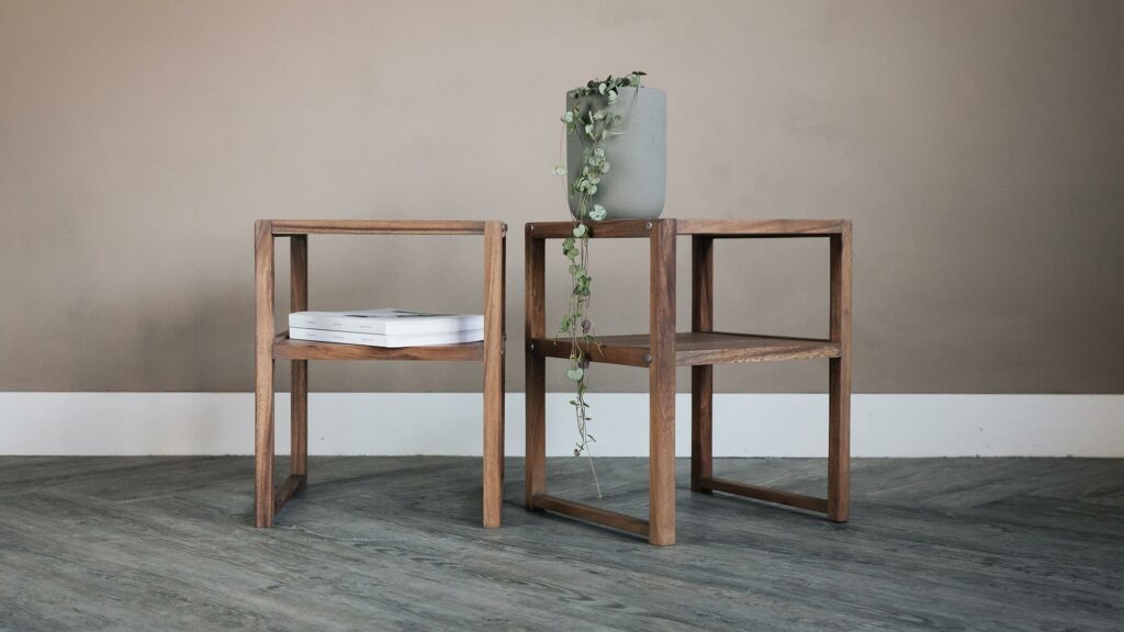 slim bedside table with open shelf in a walnut like wood