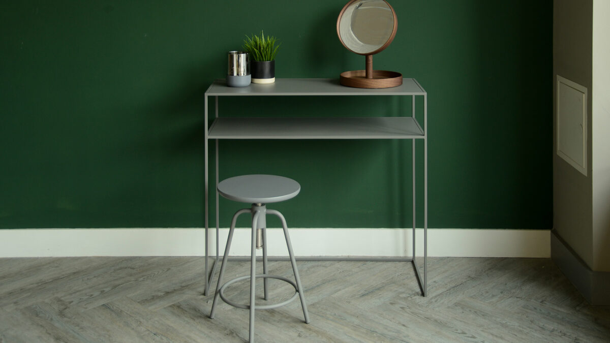 metal console table with shelf in warm grey shown with matching adjustable stool