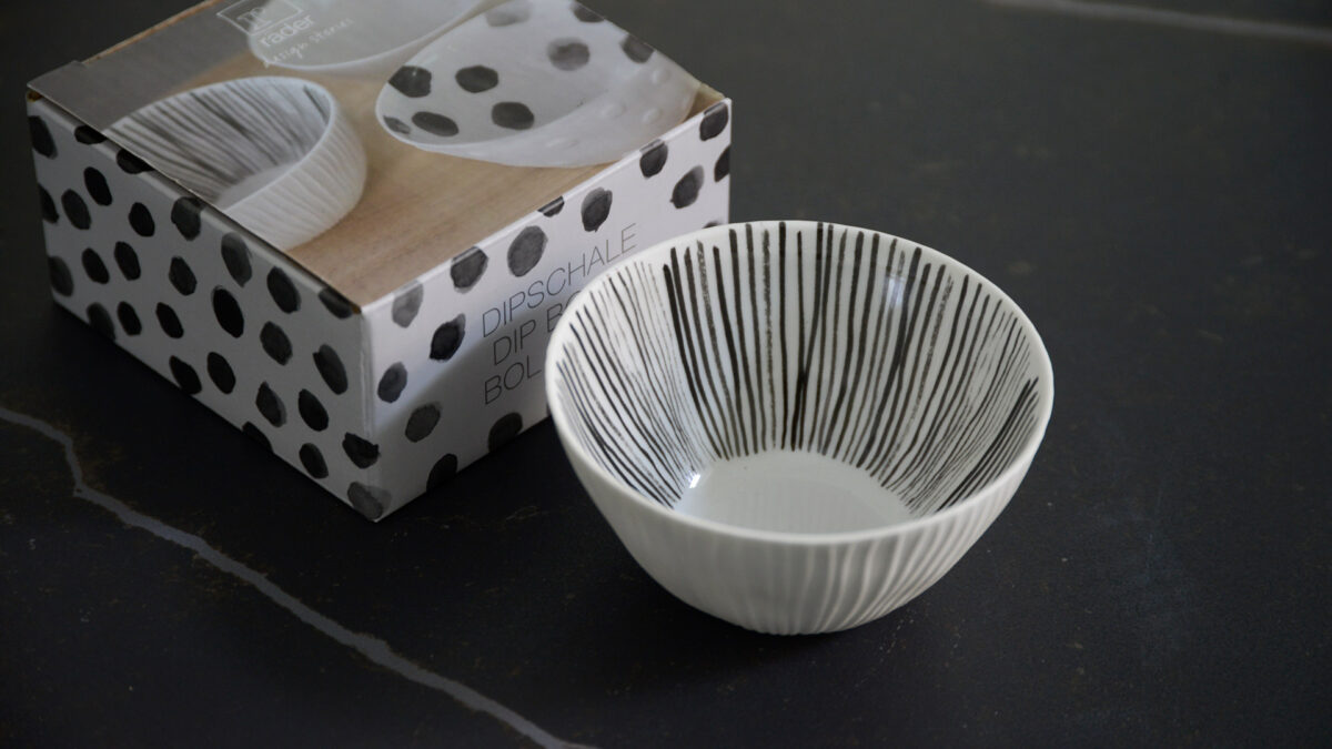 small ribbed porcelain bowl with painted grey stripes to the inside