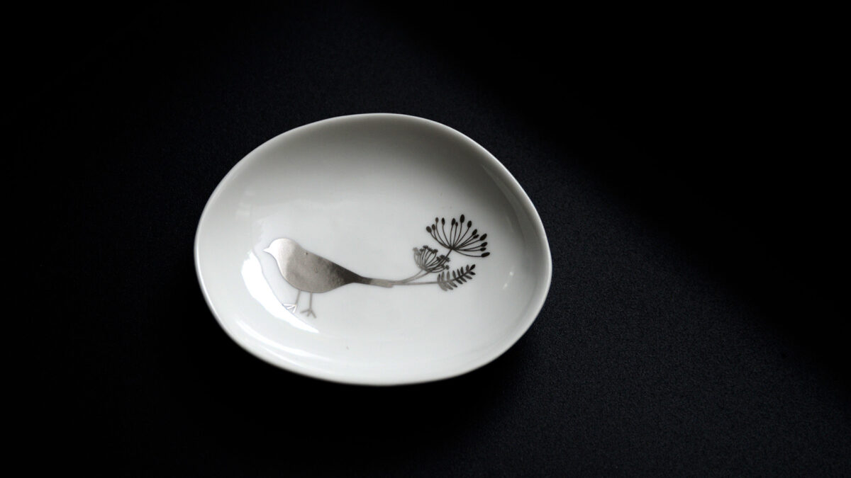 small dish with silver bird motif