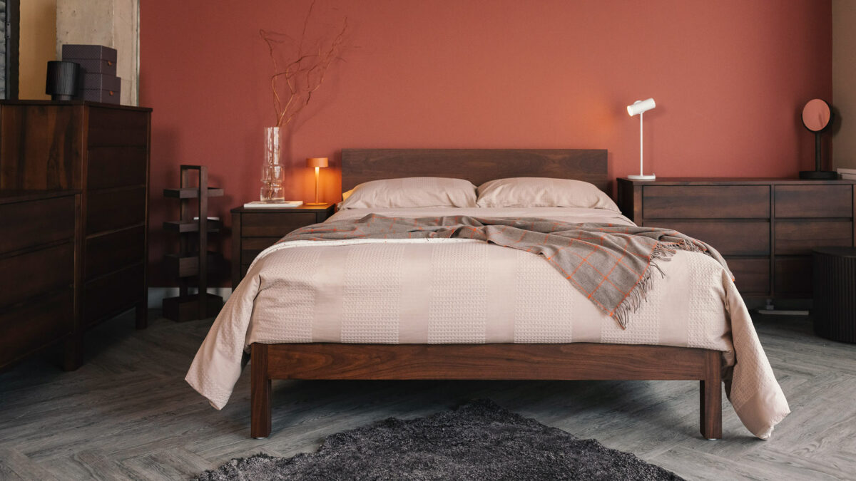 smaoked walnut malabar bed with waffle stripe bedding and cashmere throw