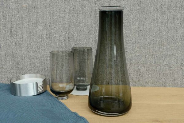 rounded smoked glass carafe shown with smoked glass tumblers