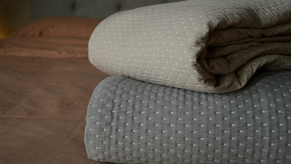 soft beige and steel grey bedspreads
