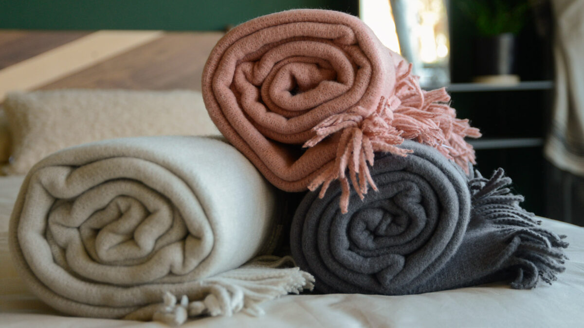 soft knit throws in rose ecru and grey