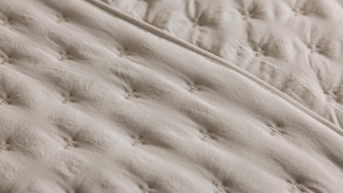 soft quilted bedspread in stone