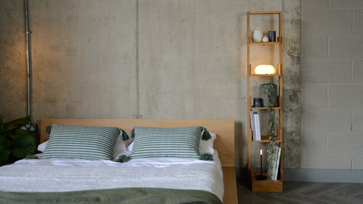 narrow freestanding oak bookshelf shown with our low oak Oregon platform bed