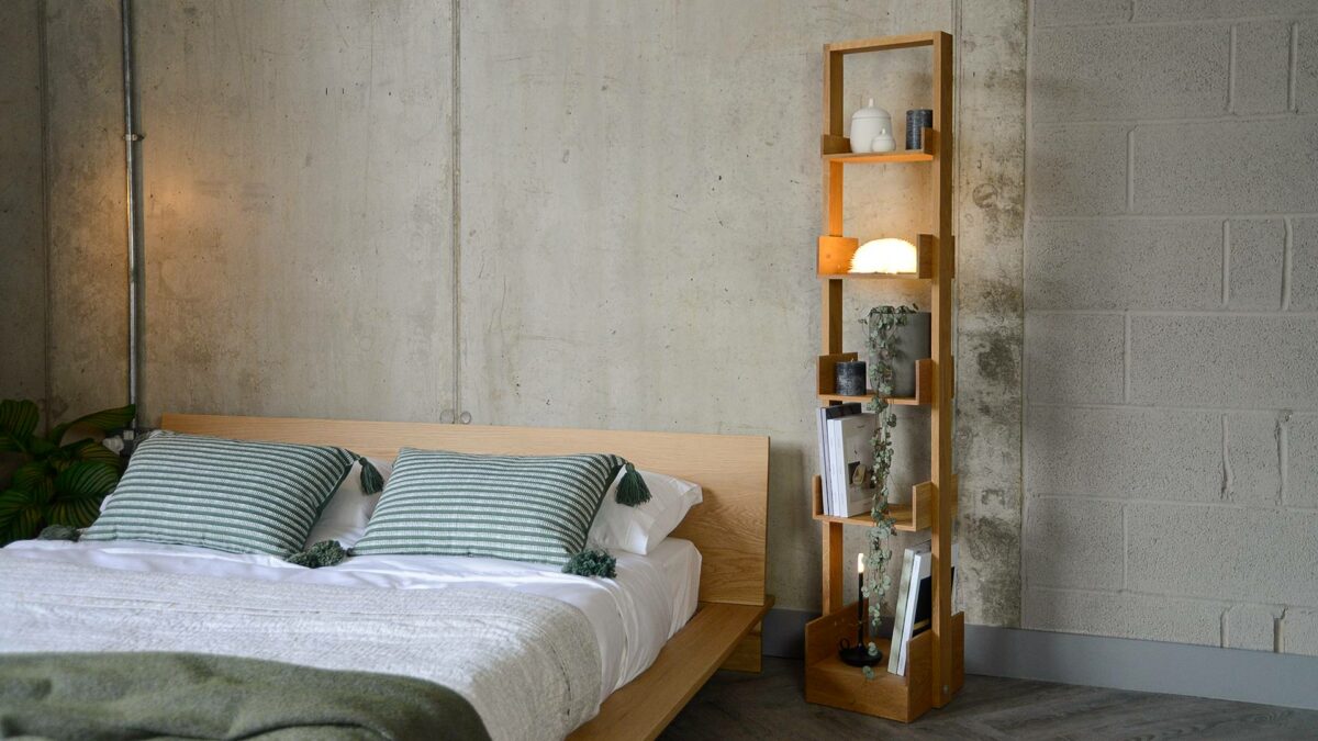 tall freestanding oak bookshelf shown with our low oak Oregon bed